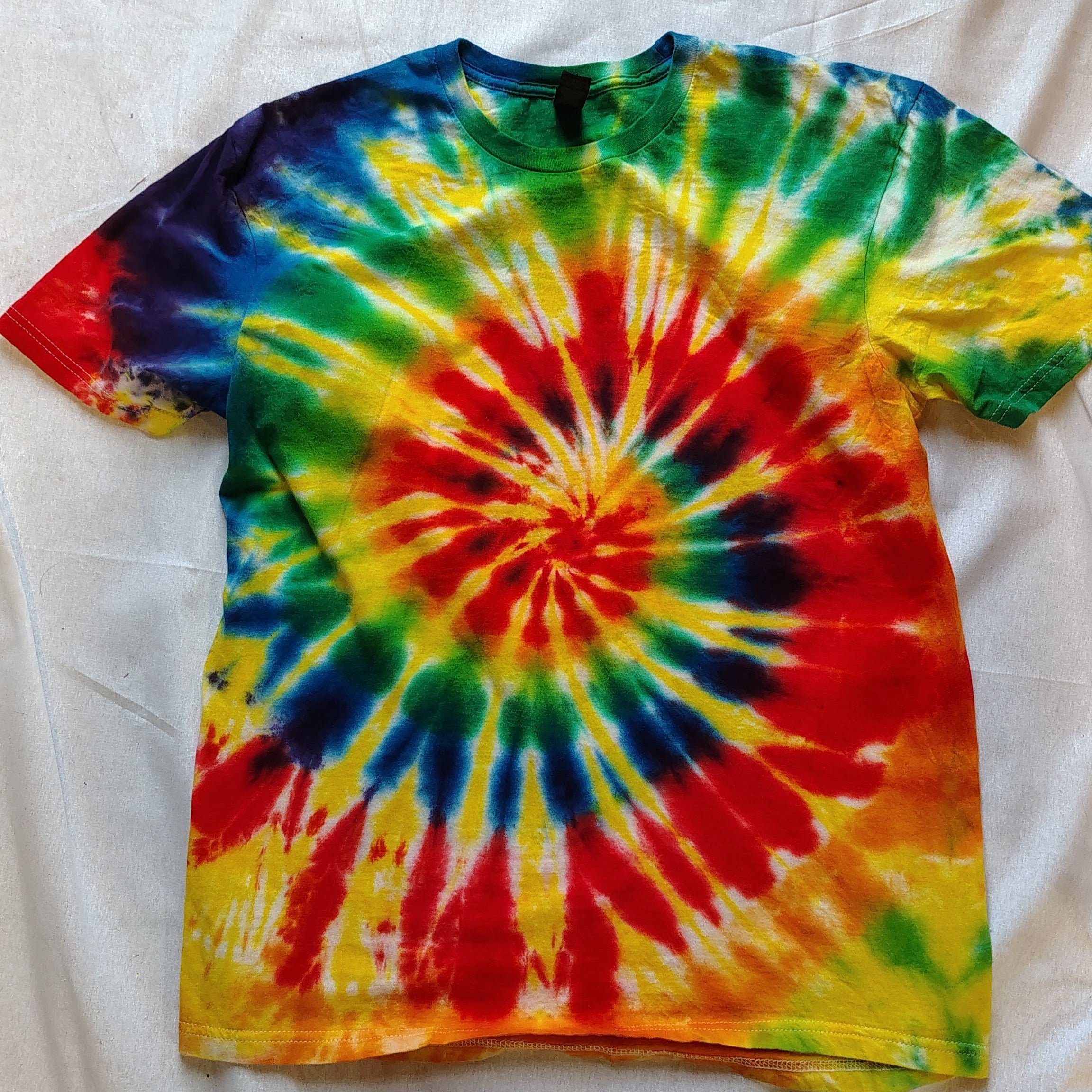 Colorful tie-dye t-shirt on a white background